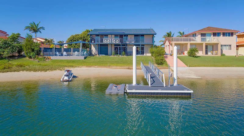 Stunning double story beach house on the waterfront with a pontoon and swimming pool!