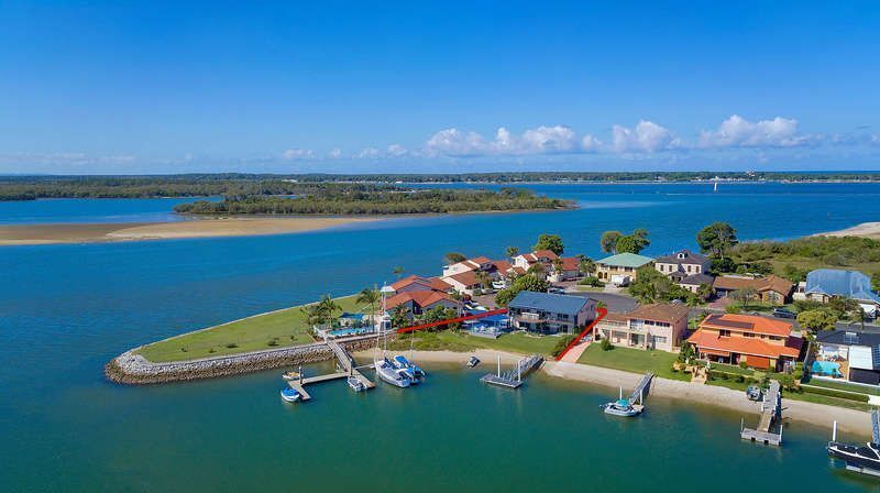 Stunning double story beach house on the waterfront with a pontoon and swimming pool!