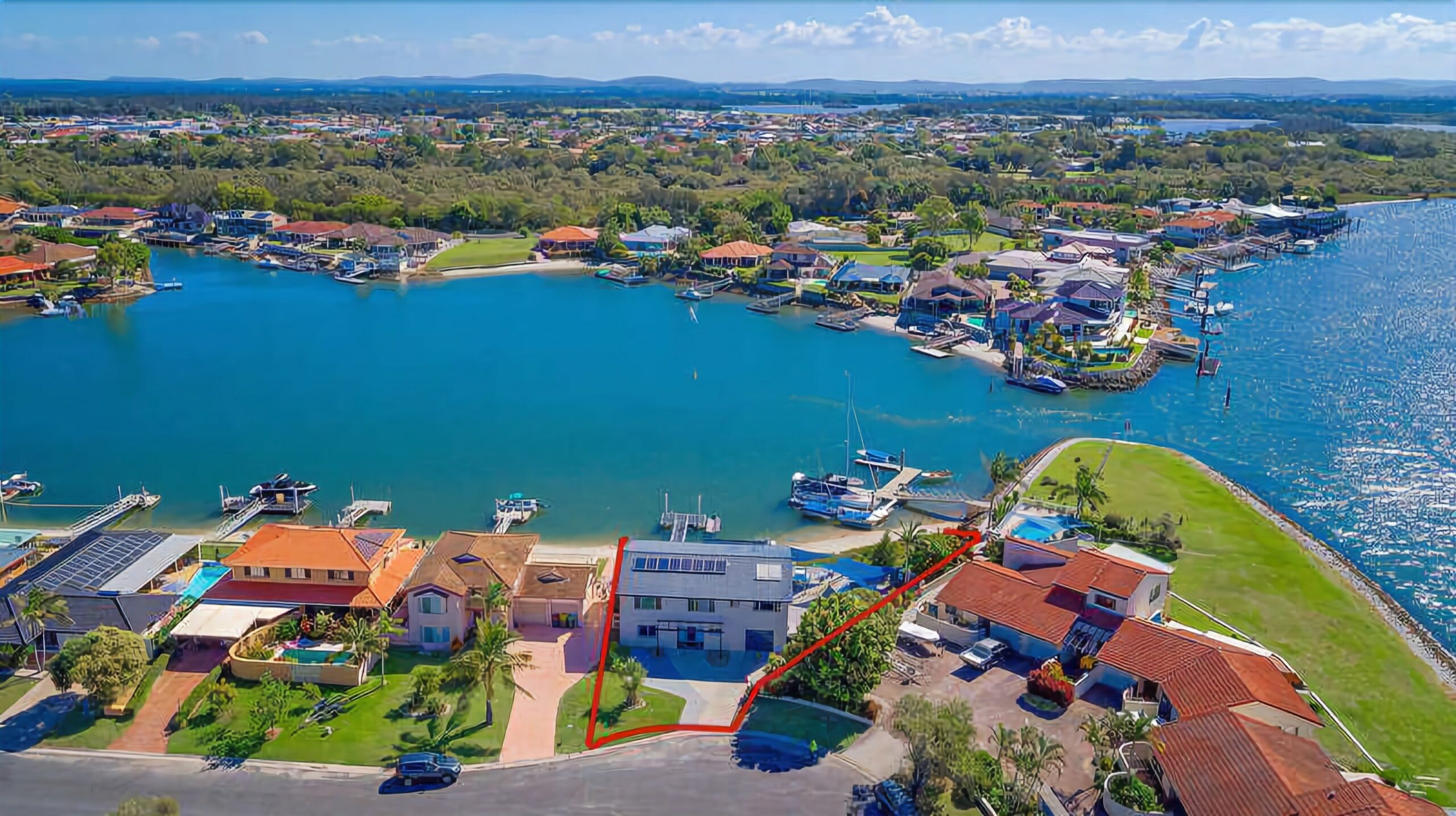 Stunning double story beach house on the waterfront with a pontoon and swimming pool!