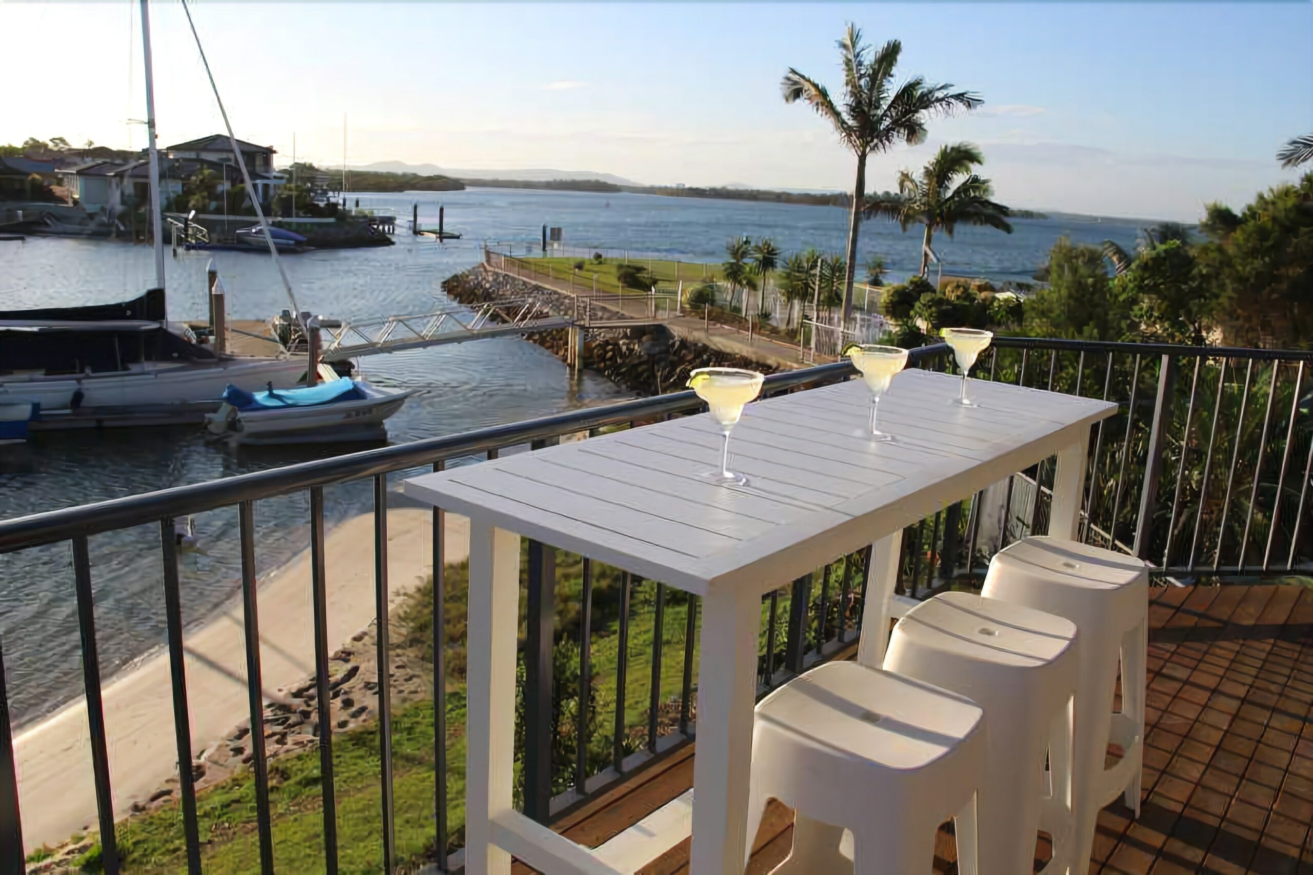 Stunning double story beach house on the waterfront with a pontoon and swimming pool!